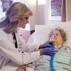 Doctor adjusting patient's trach