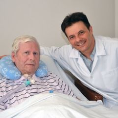 Doctor adjusting patient's trach